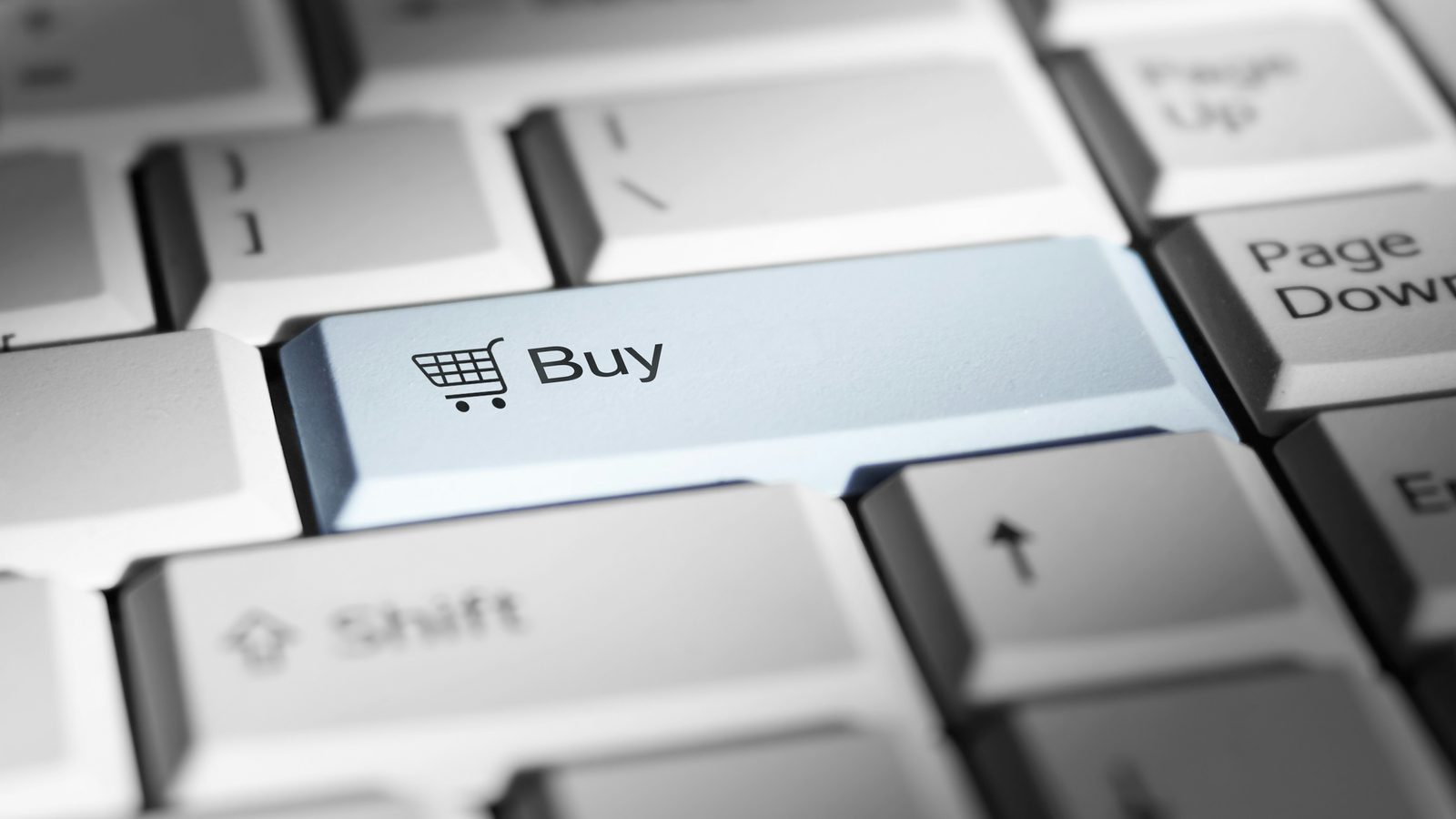 A computer keyboard with a Buy key